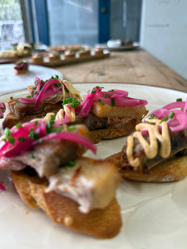 Grilled Pork Belly, Pickled Shallots, Chipotle Aioli on Crostini