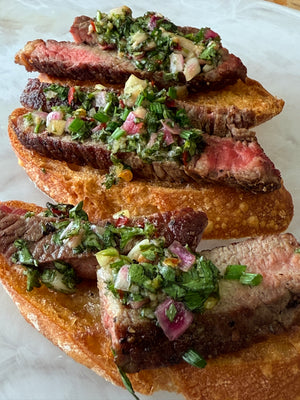 Grilled Beef, Onion Puree, Chimichurri on a Crostini